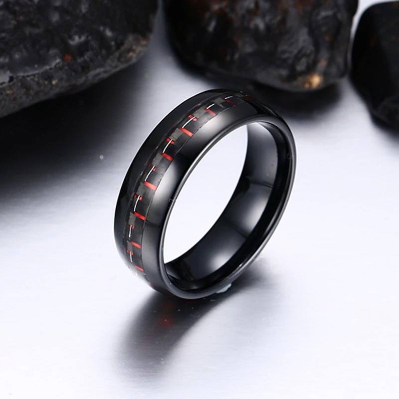 Black Tungsten Men's Wedding Band with Red Carbon Fiber Inlay With Rocks In Background | The Commander