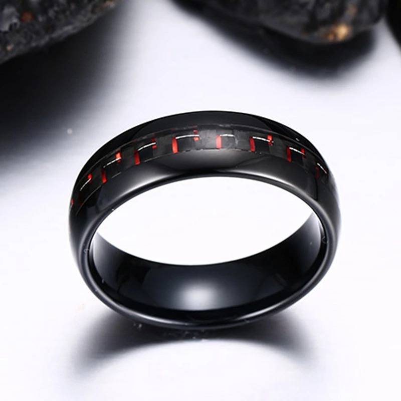 Black Tungsten Men's Wedding Band with Red Carbon Fiber Inlay With Rocks In Background | The Commander