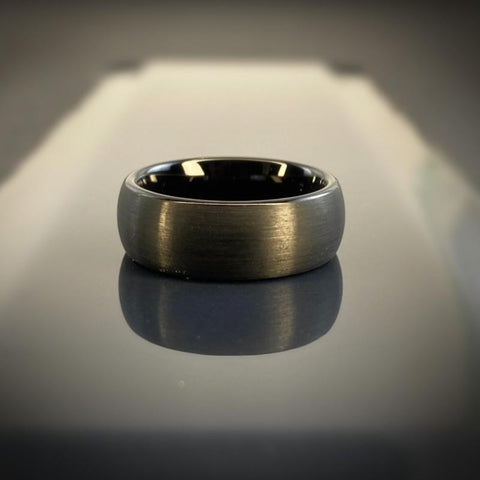 Image of Black Tungsten Men's Wedding Band with Matte Brushed Finish and Domed Design On Slate | The Continental
