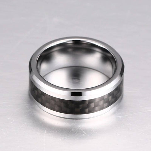Image of Tungsten Men's Wedding Band with Black Carbon Fiber Inlay and Beveled Edges Laying Flat | The Executive