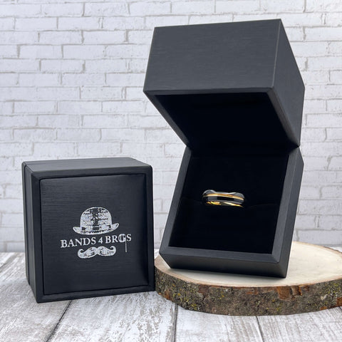 Image of Black Men's Tungsten Wedding Band with Gold Inlay displayed in a black Bands 4 Bros ring box | The Bond