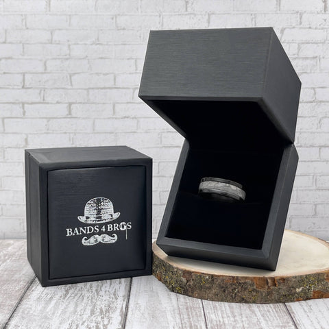 Image of Black Zirconium Men's Wedding Band With Meteorite Inlay in a Black Bands 4 Bros Ring Box | The Draco