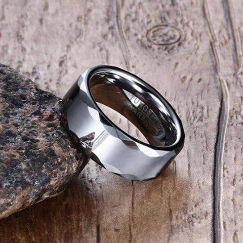 Image of Tungsten Men's Wedding Band with a Geometric Design and High Gloss Finish Leaning Against Rock | The Hammer