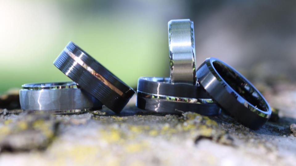 Five wedding rings placed on a tree, signifying eternal love and partnership.
