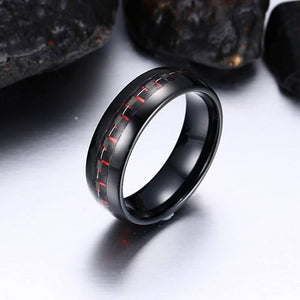 Black Tungsten Men's Wedding Band with Red Carbon Fiber Inlay With Rocks In Background | The Commander 