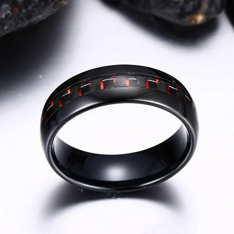 Black Tungsten Men's Wedding Band with Red Carbon Fiber Inlay With Rocks In Background | The Commander 