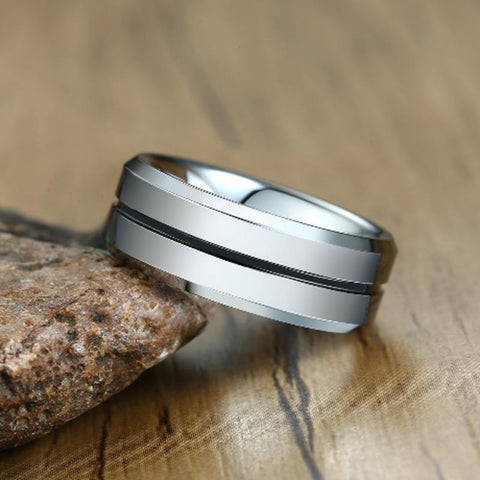 Image of Men's Wedding Band With Black Inlay Leaned Against Rock | The Diplomat