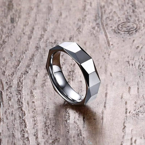 Image of Tungsten Men's Wedding Band with Geometric Design With Wood Background at a 45 Degree Angle | The Flywheel