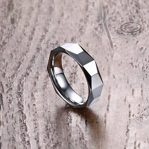 Tungsten Men's Wedding Band with Geometric Design With Wood Background at a 45 Degree Angle | The Flywheel