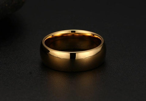 Image of Tungsten Men's Wedding Band with a Domed Design in Gold Laying Flat | The Genesis