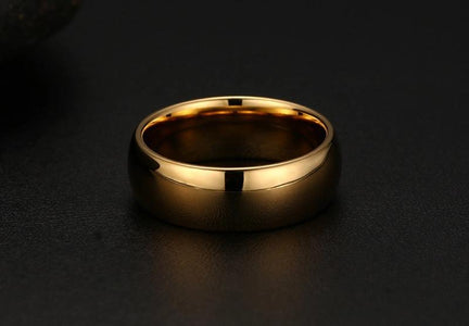Tungsten Men's Wedding Band with a Domed Design in Gold Laying Flat | The Genesis