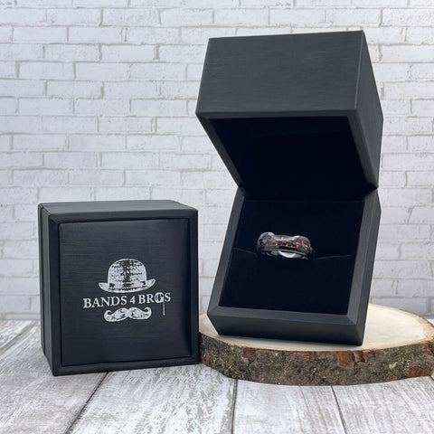 Image of Black Tungsten Men's Wedding Band with Red Carbon Fiber Inlay  in a black Bands 4 Bros ring box  | The Commander 