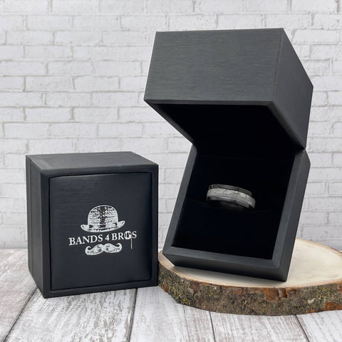 Image of Black Zirconium Men's Wedding Band With Meteorite Inlay in a Black Bands 4 Bros Ring Box | The Draco 