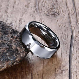 Tungsten Men's Wedding Band with a Geometric Design and High Gloss Finish Leaning Against Rock | The Hammer